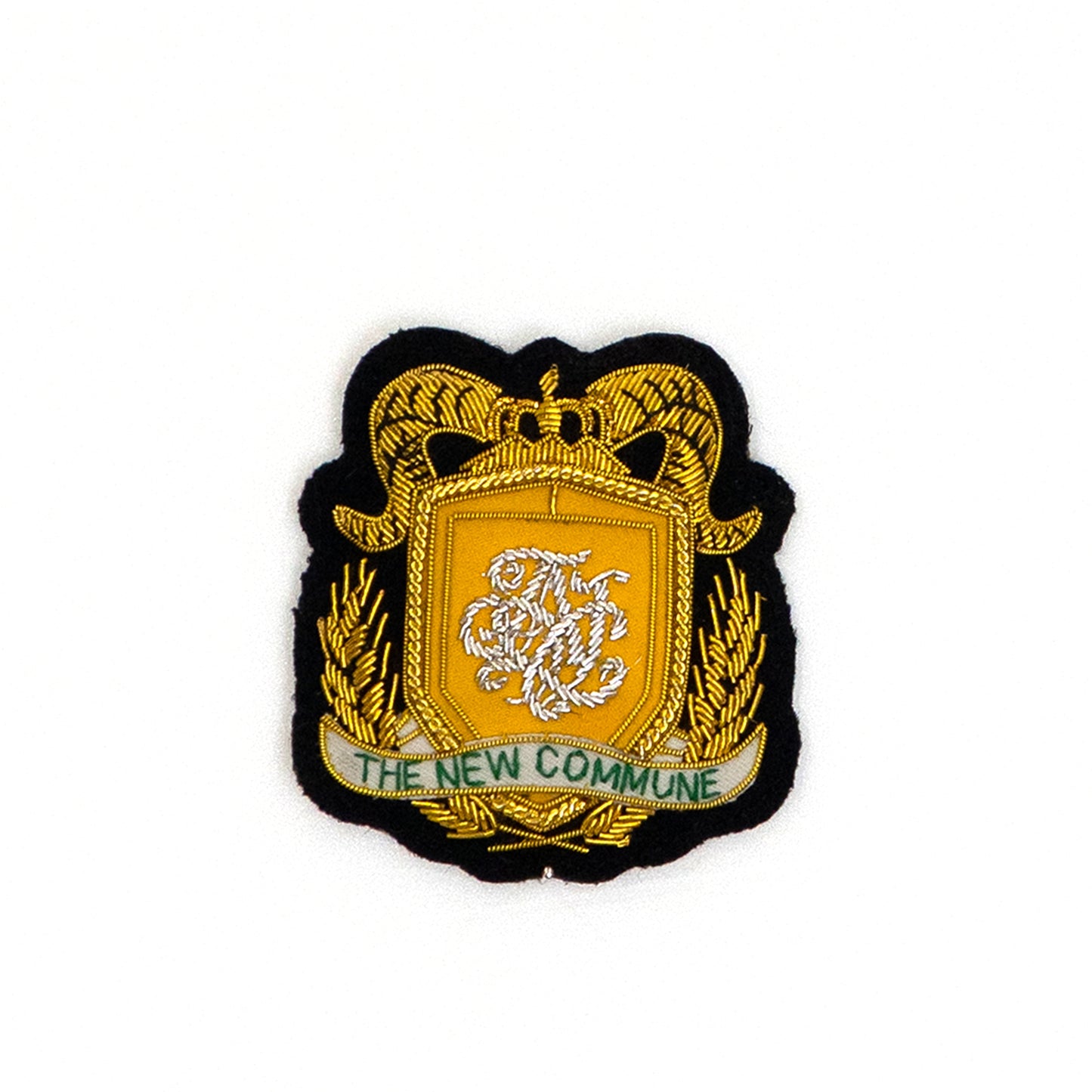 THE NEW COMMUNE Emblem