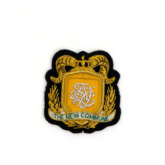 THE NEW COMMUNE Emblem